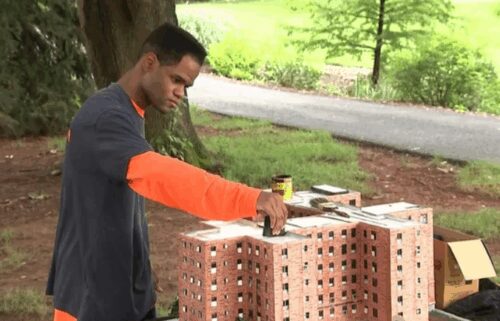 Kambel Smith works on a replica of the Marcy Houses