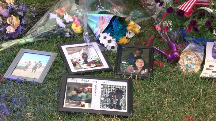 <i>WDJT via CNN Newsource</i><br/>The flowers and balloons are visible at the growing memorial outside MPD District 2. So are the cards and stuffed animals. What cannot be seen are all the prayers that were said there