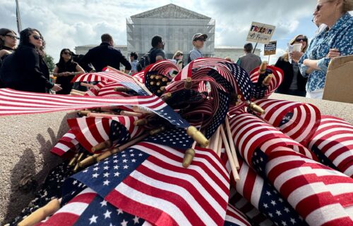 American flags are seen during a protest outside the US Supreme Court over President Donald Trump's move to end birthright citizenship as the court hears arguments over the order in Washington