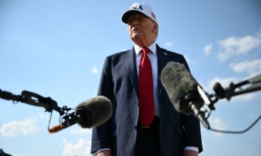 President Donald Trump speaks to reporters at Joint Base Andrews in Maryland as he departs to deliver remarks the Iowa State Fairgrounds in Des Moines on Thursday.