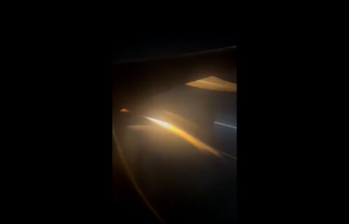 Flames streak from the right engine of Sun Country Flight 430 as it prepares to make an emergency landing at Los Angels International Airport on July 14 morning.