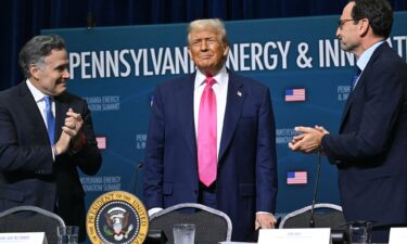 President Donald Trump with Sen. Dave McCormick (L) and CEO of Blackstone Group Jon Gray (R) on the campus of Carnegie Mellon University in Pittsburgh on July 15.