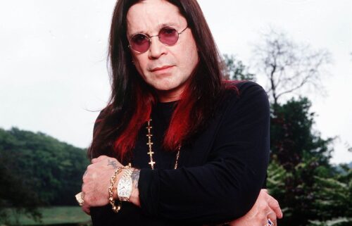 British musician Ozzy Osbourne poses for photographs at his mansion in May 2002 in Chalfort St Peter