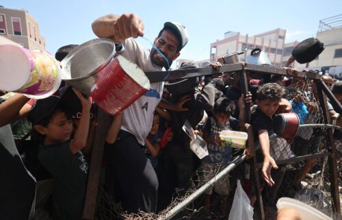 Palestinians gather at a food distribution point in the Nuseirat refugee camp in the central Gaza Strip on July 19. The World Food Programme said nearly one in three people in Gaza were not eating for days at a stretch and "thousands" were "on the verge of catastrophic hunger".