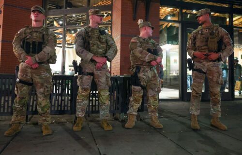 Members of the Ohio National Guard wear their sidearms while patrolling in the Logan Circle neighborhood