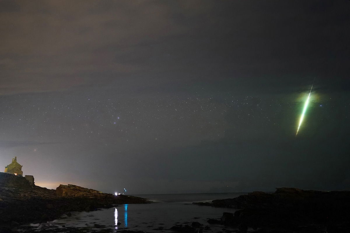 <i>Owen Humphreys/PA Images/Getty Images via CNN Newsource</i><br/>The Draconid meteor shower lights up the night sky in October 2021.