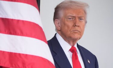 President Donald Trump waits to greet Argentina's President Javier Milei